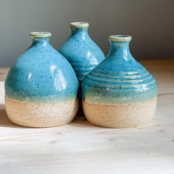 blue and tan handmade ceramic watering bells