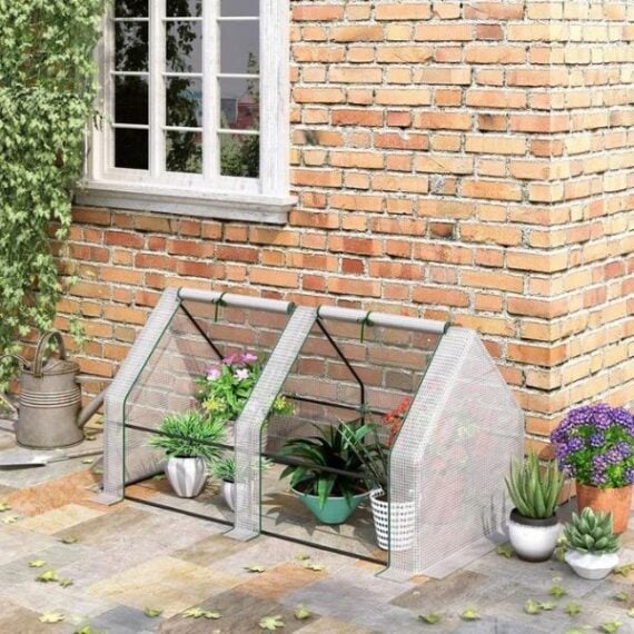 mini, low greenhouse covering plants on the ground